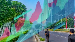 City street in China with modern skyscrapers and green trees, people walking and cycling.