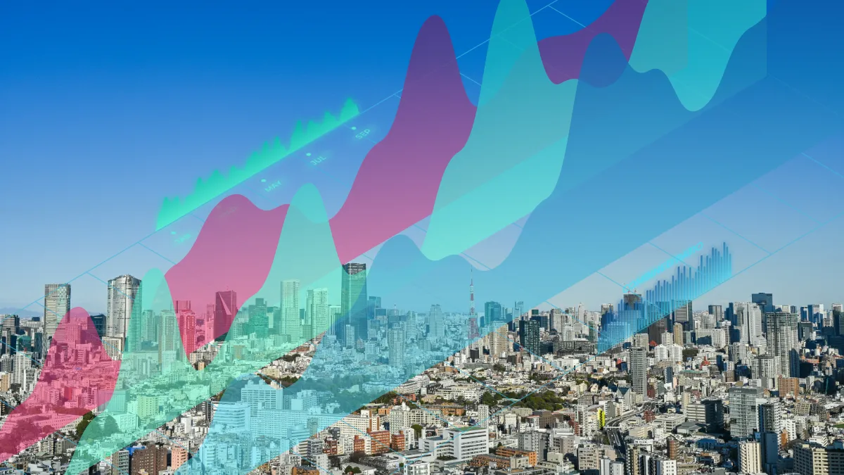 City skyline overlaid with translucent, multicolored financial charts and rising graph lines.