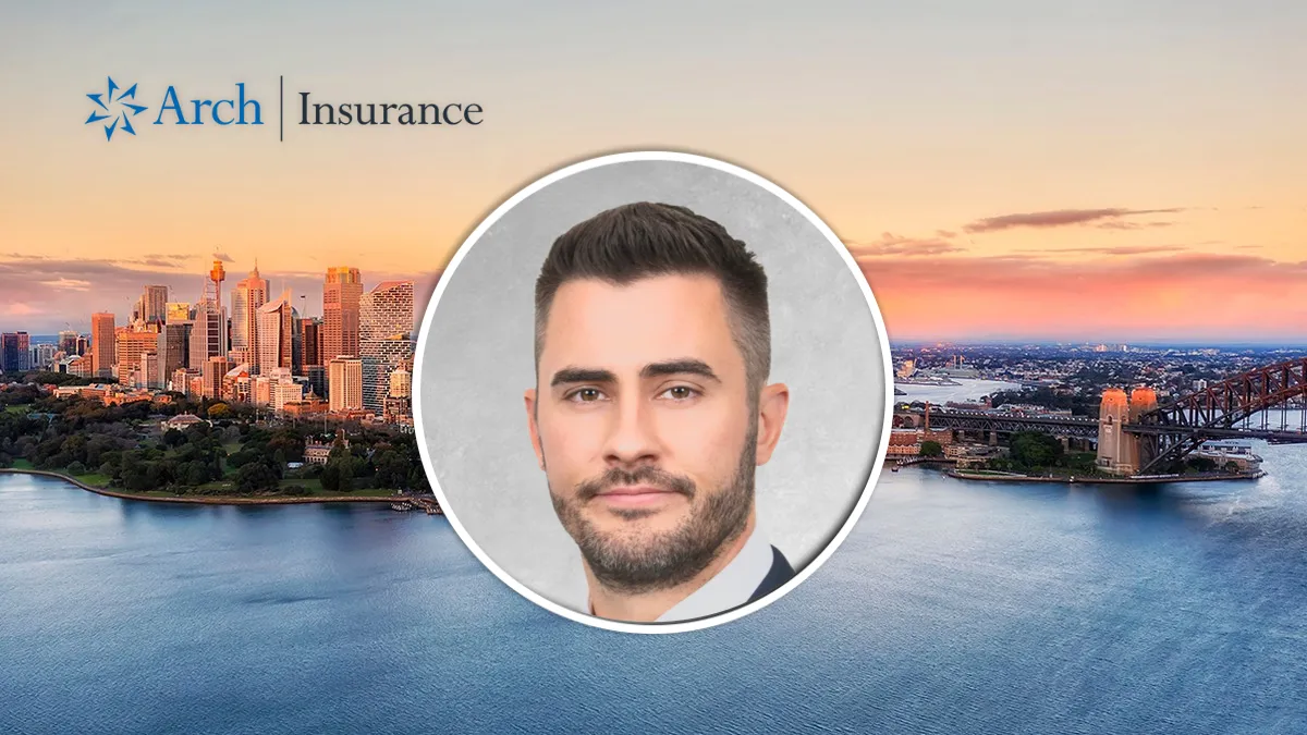 Andrew Whitlock, head of casualty at Arch Insurance, pictured over Sydney skyline with the Arch Insurance logo.