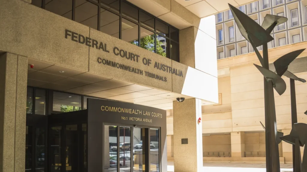 Entrance to Australia’s Federal Court and Commonwealth Law Courts building, with an abstract metal sculpture.