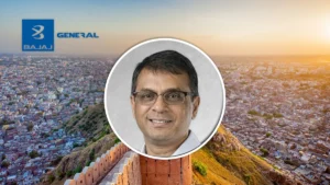 Deepak Reddy, incoming MD and CEO of Bajaj General Insurance, pictured over a cityscape with the company logo.