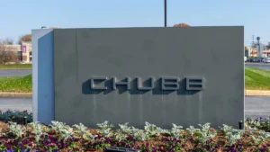 Chubb’s Asia P&C premiums rise 7.5% in third quarter Chubb sign outside a building, set behind landscaped flower beds.