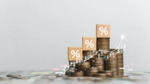 CoverGo secures US$6m in Series B1 led by Betatron Venture Group Stacks of coins topped with percentage symbols and overlaid with a rising financial graph.