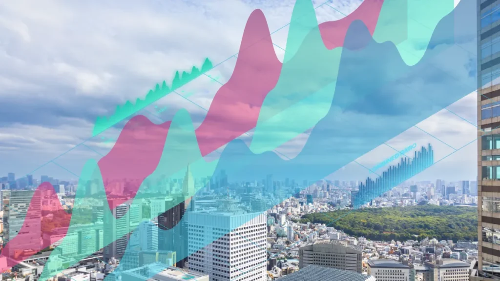 Tokyo cityscape with translucent rising and falling financial charts overlaid.