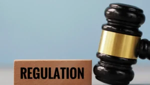 Hong Kong Insurance Authority suspends six individual brokers over AML, CTF breaches Gavel beside a wooden block marked “REGULATION” symbolizing insurance regulatory enforcement.