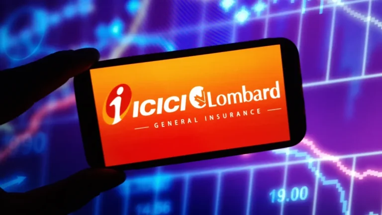 A hand holds a smartphone displaying the ICICI Lombard General Insurance logo against glowing financial charts.