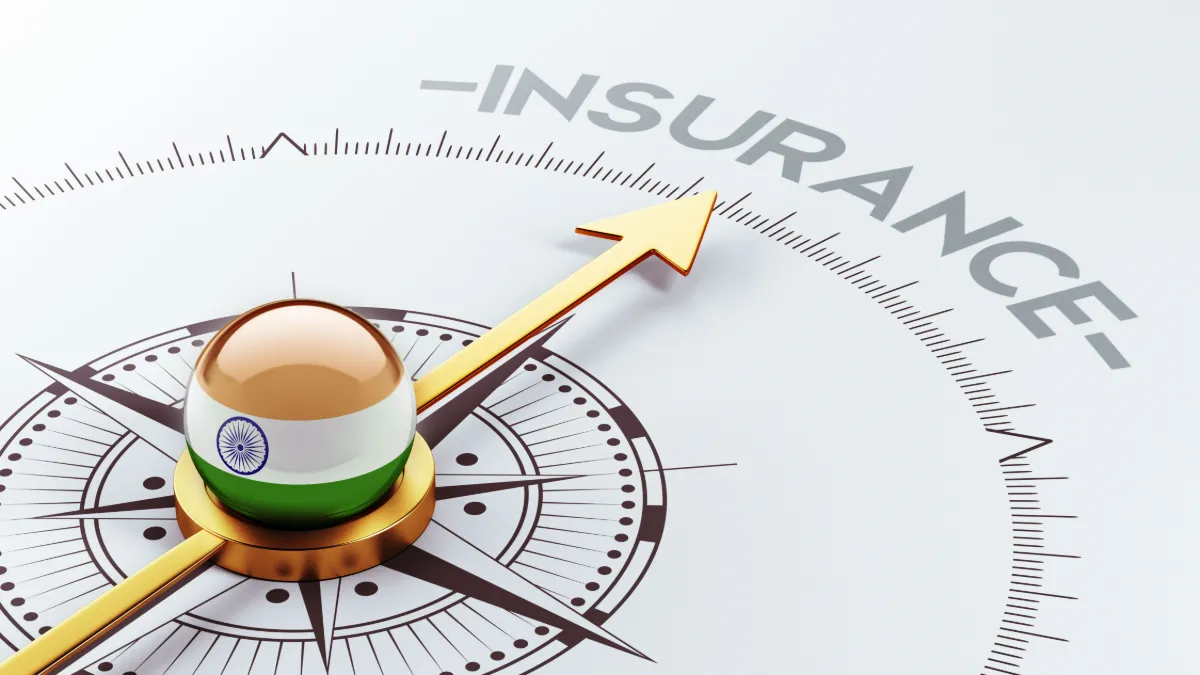 Compass with an India-themed globe points toward the word “INSURANCE.
