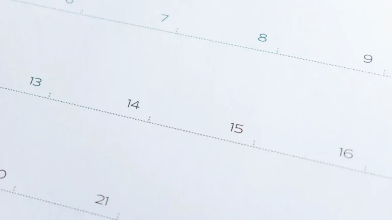 Close-up of a calendar page showing numbered dates including 7, 8, 9 and 13 to 16.