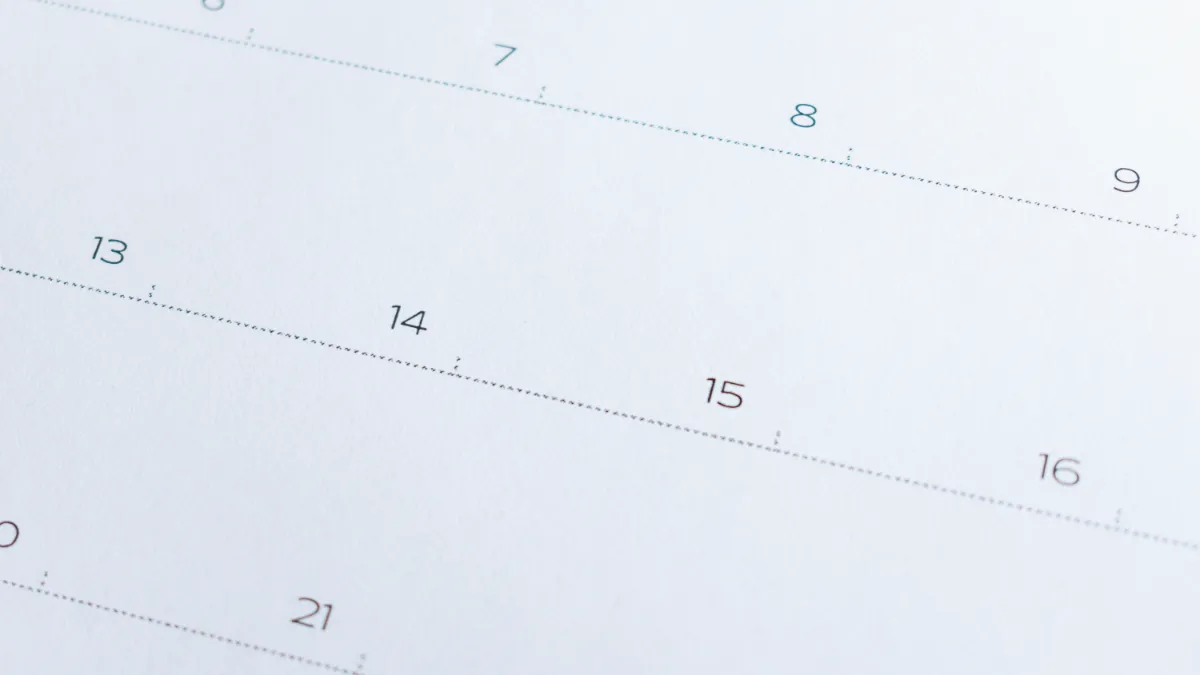Close-up of a calendar page showing numbered dates including 7, 8, 9 and 13 to 16.
