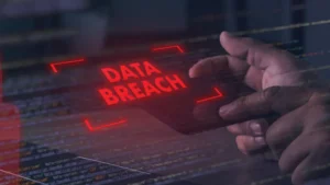 Mirae Asset Life Insurance suffers data leak following cyberattack Hands hover over a tablet displaying red “DATA BREACH” text above lines of computer code.