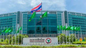 PVI Insurance partners with KBank, eyes APAC expansion opportunities Kasikornbank headquarters with Thai and green flags outside.