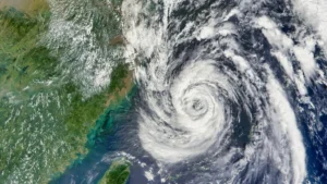 Taiwan shuts stock exchange, cancels hundreds of flights as Typhoon Champi draws closer Satellite view of Typhoon Champi swirling east of Taiwan, with dense clouds surrounding its eye.